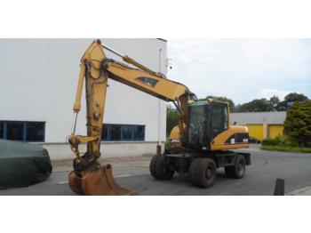 Escavatore gommato Caterpillar M 318 C: foto 1