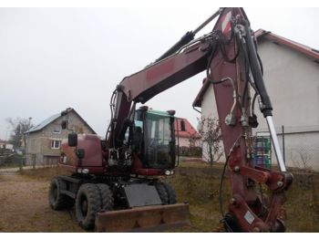 Escavatore gommato CATERPILLAR M313D