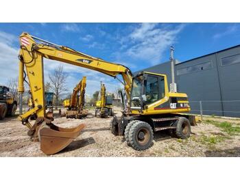 Escavatore gommato CATERPILLAR M315