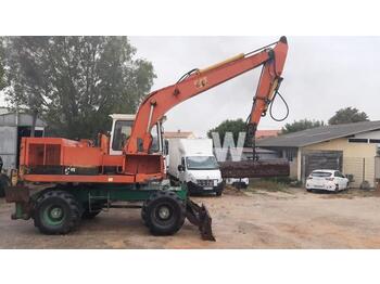 Escavatore gommato Caterpillar 212BFT