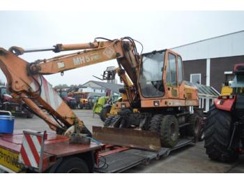 Escavatore gommato O&K MH 5