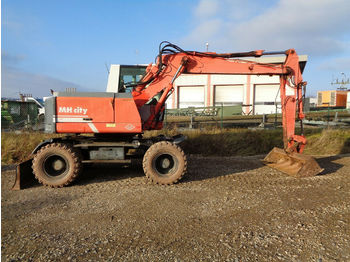 Escavatore gommato O & K MH CITY