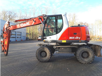 Escavatore gommato O&K MH City