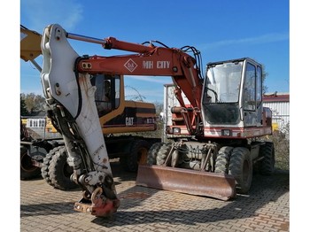 Escavatore gommato O & K MH City Mobilbagger