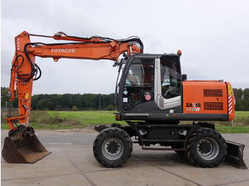 Escavatore gommato HITACHI ZX140W: foto 1
