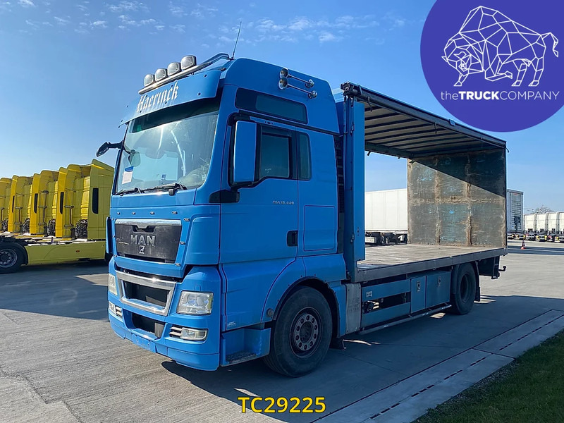 MAN TGX 440 - Autocarro con pianale/ Cassone fisso: foto 1 MAN TGX 440 - Autocarro con pianale/ Cassone fisso: foto 1