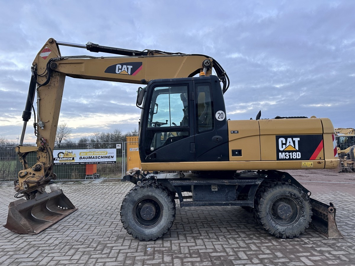 CATERPILLAR M 318 D full Hydr. Top Zustand German machine ! - Escavatore gommato: foto 1 CATERPILLAR M 318 D full Hydr. Top Zustand German machine ! - Escavatore gommato: foto 1