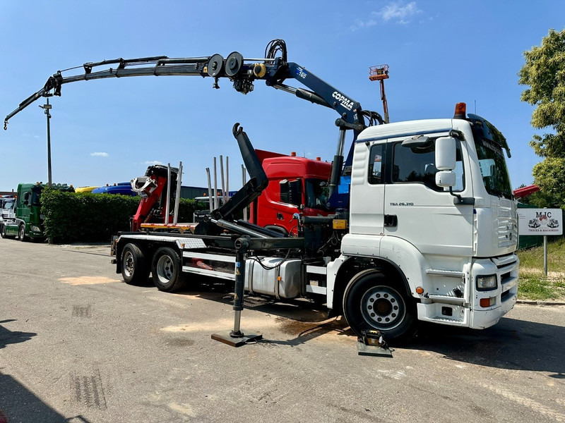 MAN TGA 26.310 6X2 HOOKLIFT + CRANE COPMA 160.4 + JIB J2 + WINCH - RADIO - LIFT + STEERING AXLE - EURO 3 - BE - Camion con gru: foto 1 MAN TGA 26.310 6X2 HOOKLIFT + CRANE COPMA 160.4 + JIB J2 + WINCH - RADIO - LIFT + STEERING AXLE - EURO 3 - BE - Camion con gru: foto 1