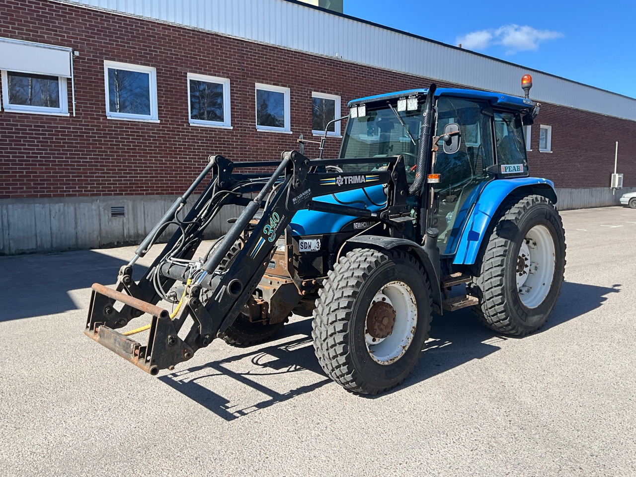 New Holland TL90 - Trattore: foto 1 New Holland TL90 - Trattore: foto 1