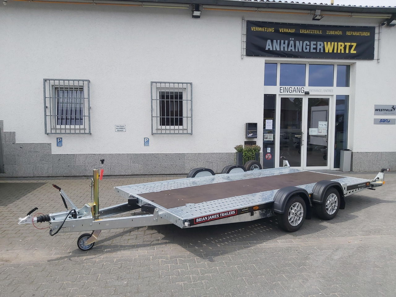 Brian James A4 Transporter 450x200cm black X Rampen 240cm Stützen Alufelgen silver 2600kg - Rimorchio trasporto automezzi: foto 1 Brian James A4 Transporter 450x200cm black X Rampen 240cm Stützen Alufelgen silver 2600kg - Rimorchio trasporto automezzi: foto 1