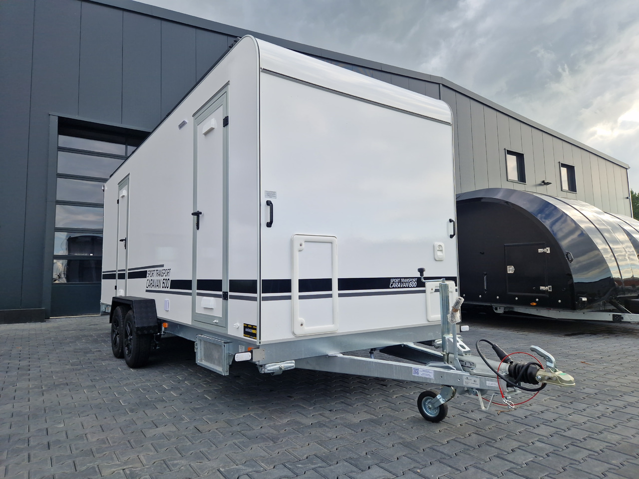 Koffer Sport Camp TFS 600.01 600x200x210cm Premium Laderaum 300cm Seitentür Wohnabteil 3000kg 100km - Rimorchio per auto: foto 2 Koffer Sport Camp TFS 600.01 600x200x210cm Premium Laderaum 300cm Seitentür Wohnabteil 3000kg 100km - Rimorchio per auto: foto 2