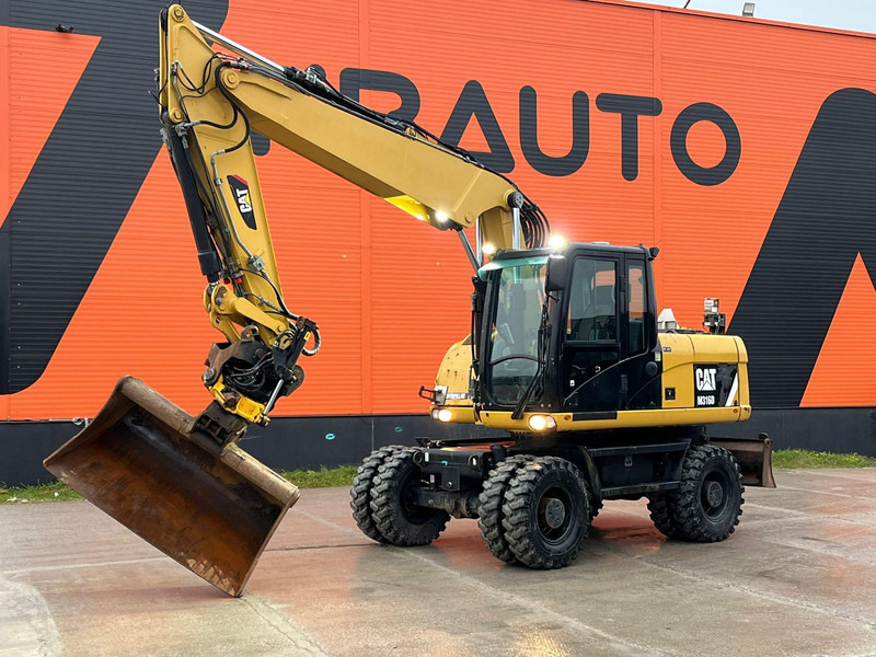 Caterpillar M316D / ROTOTILT/ AC / CENTRAL LUBRICATION / + EXTRA BUCKET - Escavatore gommato: foto 1 Caterpillar M316D / ROTOTILT/ AC / CENTRAL LUBRICATION / + EXTRA BUCKET - Escavatore gommato: foto 1