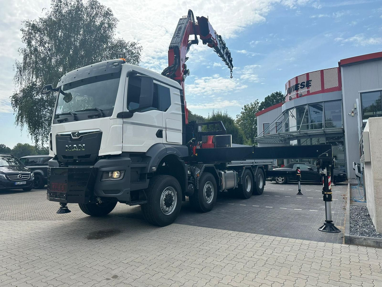 MAN TGS 41.520 8x8 mit Fassi Ladekran F710RA.2.26 - Autocarro con pianale/ Cassone fisso: foto 2 MAN TGS 41.520 8x8 mit Fassi Ladekran F710RA.2.26 - Autocarro con pianale/ Cassone fisso: foto 2