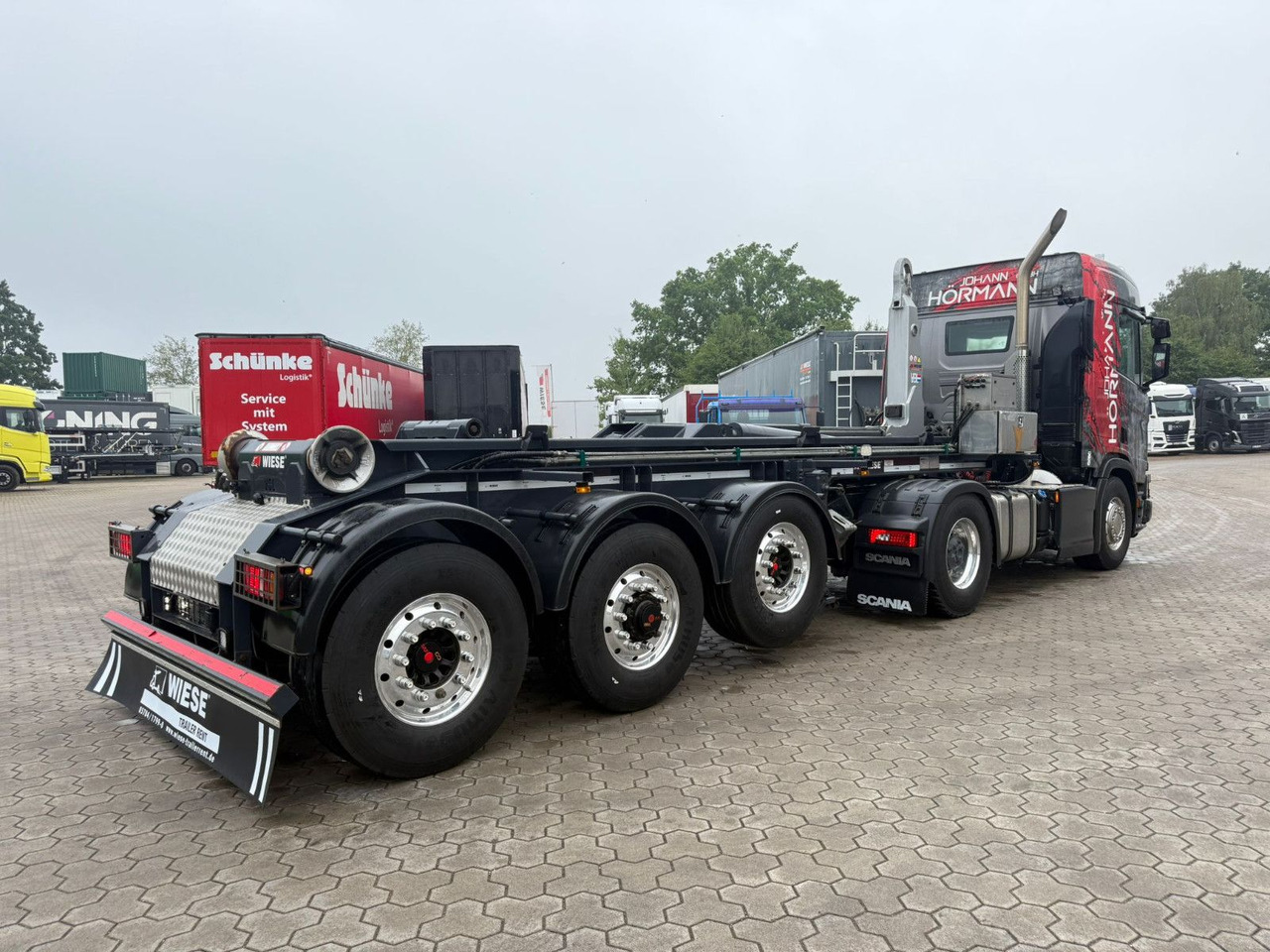 Wiese 3-Achs Abrollkipper Auflieger TRAK Achse - Semirimorchio portacontainer/ Caisse interchangeable: foto 2 Wiese 3-Achs Abrollkipper Auflieger TRAK Achse - Semirimorchio portacontainer/ Caisse interchangeable: foto 2