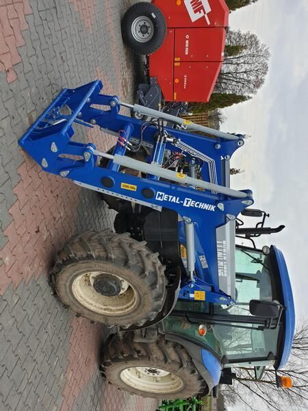 Metal-Technik für NEW HOLLAND TL 90 - Caricatore frontale per trattori: foto 1 Metal-Technik für NEW HOLLAND TL 90 - Caricatore frontale per trattori: foto 1