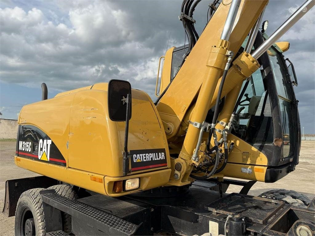 Escavatore gommato CAT M315C: foto 17 Escavatore gommato CAT M315C: foto 17