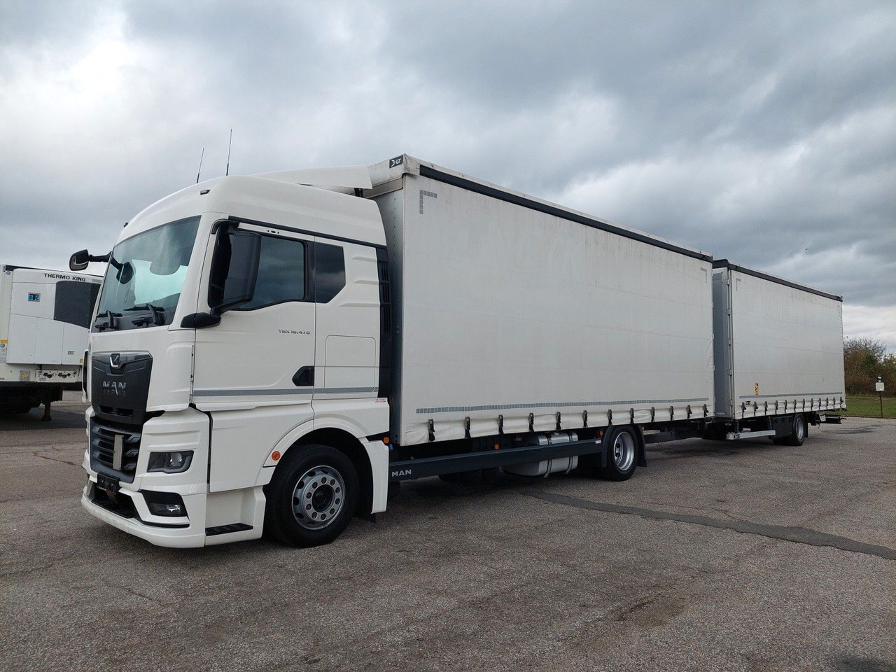MAN TGX 18.470 LL + Gniotpol G-4080 120 m3 Durchbar - Camion centinato: foto 1 MAN TGX 18.470 LL + Gniotpol G-4080 120 m3 Durchbar - Camion centinato: foto 1