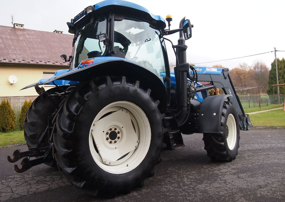 Ciągnik New Holland NH TS125A 6 cylindrów 2004 Ciągnik rolniczy New Holland TS125A - Trattore: foto 4 Ciągnik New Holland NH TS125A 6 cylindrów 2004 Ciągnik rolniczy New Holland TS125A - Trattore: foto 4