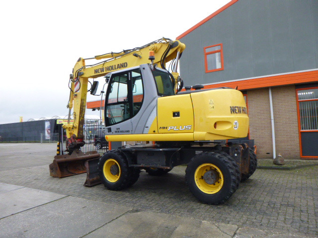NEW HOLLAND MH PLUS - Escavatore gommato: foto 3 NEW HOLLAND MH PLUS - Escavatore gommato: foto 3