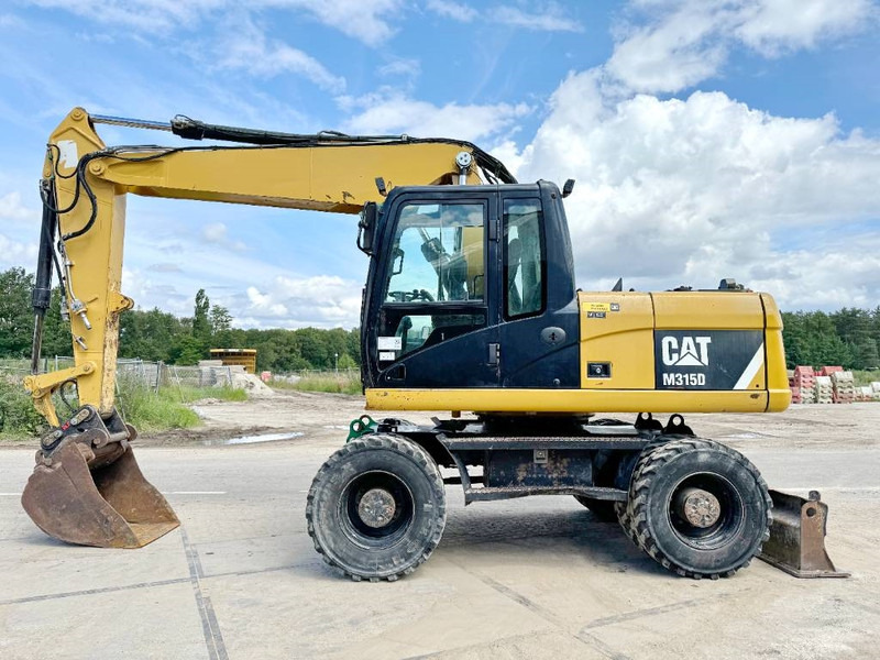 Cat M315D - Triple Boom / Quick Coupler - Escavatore gommato: foto 1 Cat M315D - Triple Boom / Quick Coupler - Escavatore gommato: foto 1