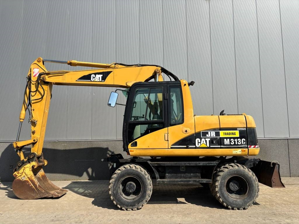 CAT M 313 C (Low verified hours) - Escavatore gommato: foto 1 CAT M 313 C (Low verified hours) - Escavatore gommato: foto 1