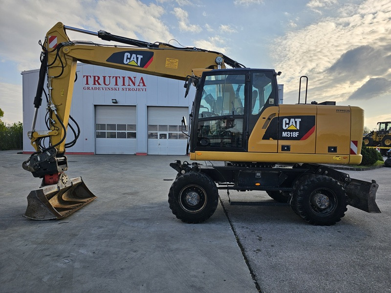 CATERPILLAR M318F - Escavatore gommato: foto 1 CATERPILLAR M318F - Escavatore gommato: foto 1