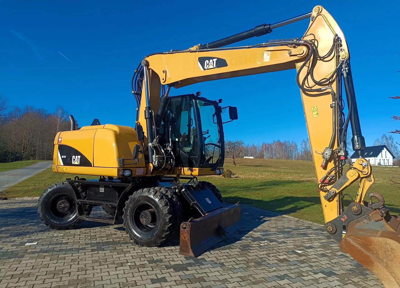CATERPILLAR M313D - Escavatore gommato: foto 2 CATERPILLAR M313D - Escavatore gommato: foto 2