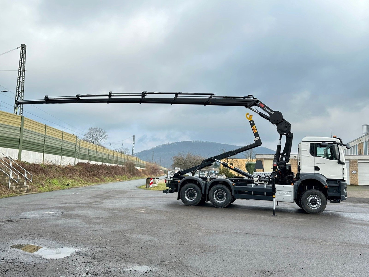 MAN TGS 33.440 6x6 BB Abrollkipper+Kran Hiab 228-6 - Autocarro scarrabile, Camion con gru: foto 4 MAN TGS 33.440 6x6 BB Abrollkipper+Kran Hiab 228-6 - Autocarro scarrabile, Camion con gru: foto 4