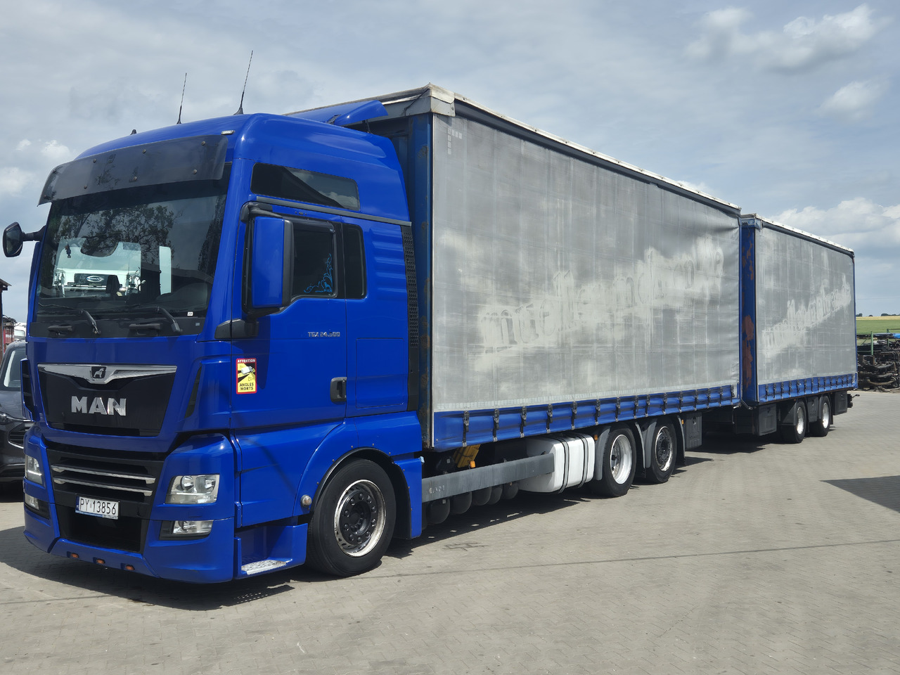MAN tgx 24,500 - Camion centinato: foto 2 MAN tgx 24,500 - Camion centinato: foto 2