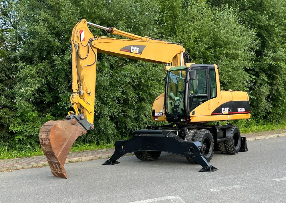 Caterpillar CAT M315C  CATERPILLAR SPROWADZONY  Bardzo Dobry Stan - Escavatore gommato: foto 1 Caterpillar CAT M315C  CATERPILLAR SPROWADZONY  Bardzo Dobry Stan - Escavatore gommato: foto 1