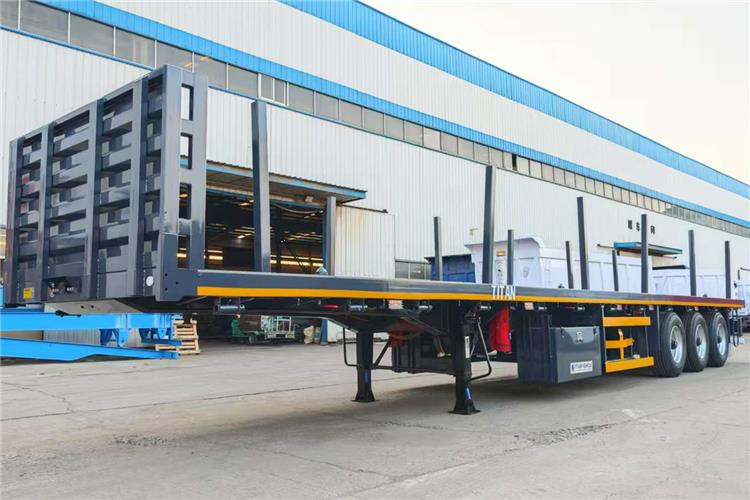 TITAN 3 Axle Flatbed Trailer Truck With Wooden Piles Price In Guma - Semirimorchio portacontainer/ Caisse interchangeable: foto 2 TITAN 3 Axle Flatbed Trailer Truck With Wooden Piles Price In Guma - Semirimorchio portacontainer/ Caisse interchangeable: foto 2