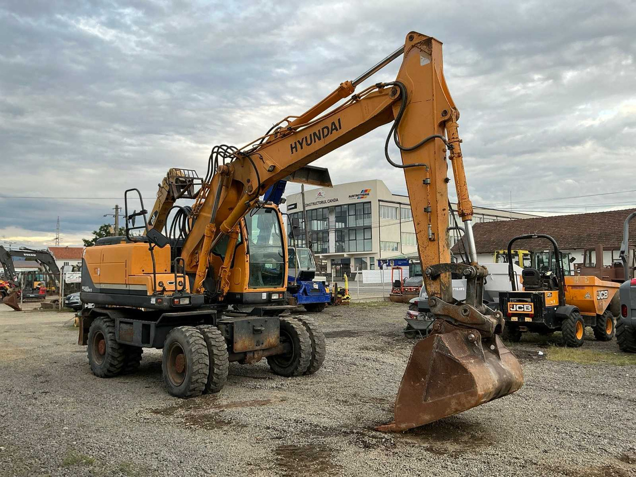 HYUNDAI ROBEX 140W-9 - Escavatore gommato: foto 1 HYUNDAI ROBEX 140W-9 - Escavatore gommato: foto 1