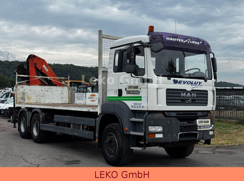 MAN TGA 33.360 - Autocarro con pianale/ Cassone fisso, Camion con gru: foto 1 MAN TGA 33.360 - Autocarro con pianale/ Cassone fisso, Camion con gru: foto 1