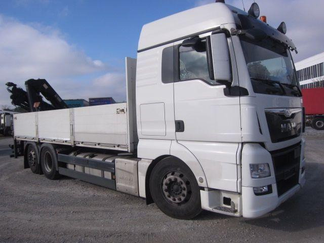 MAN TGX 26.440 mit Hiab-Kran Funkfernbedienung - Autocarro con pianale/ Cassone fisso, Camion con gru: foto 1 MAN TGX 26.440 mit Hiab-Kran Funkfernbedienung - Autocarro con pianale/ Cassone fisso, Camion con gru: foto 1