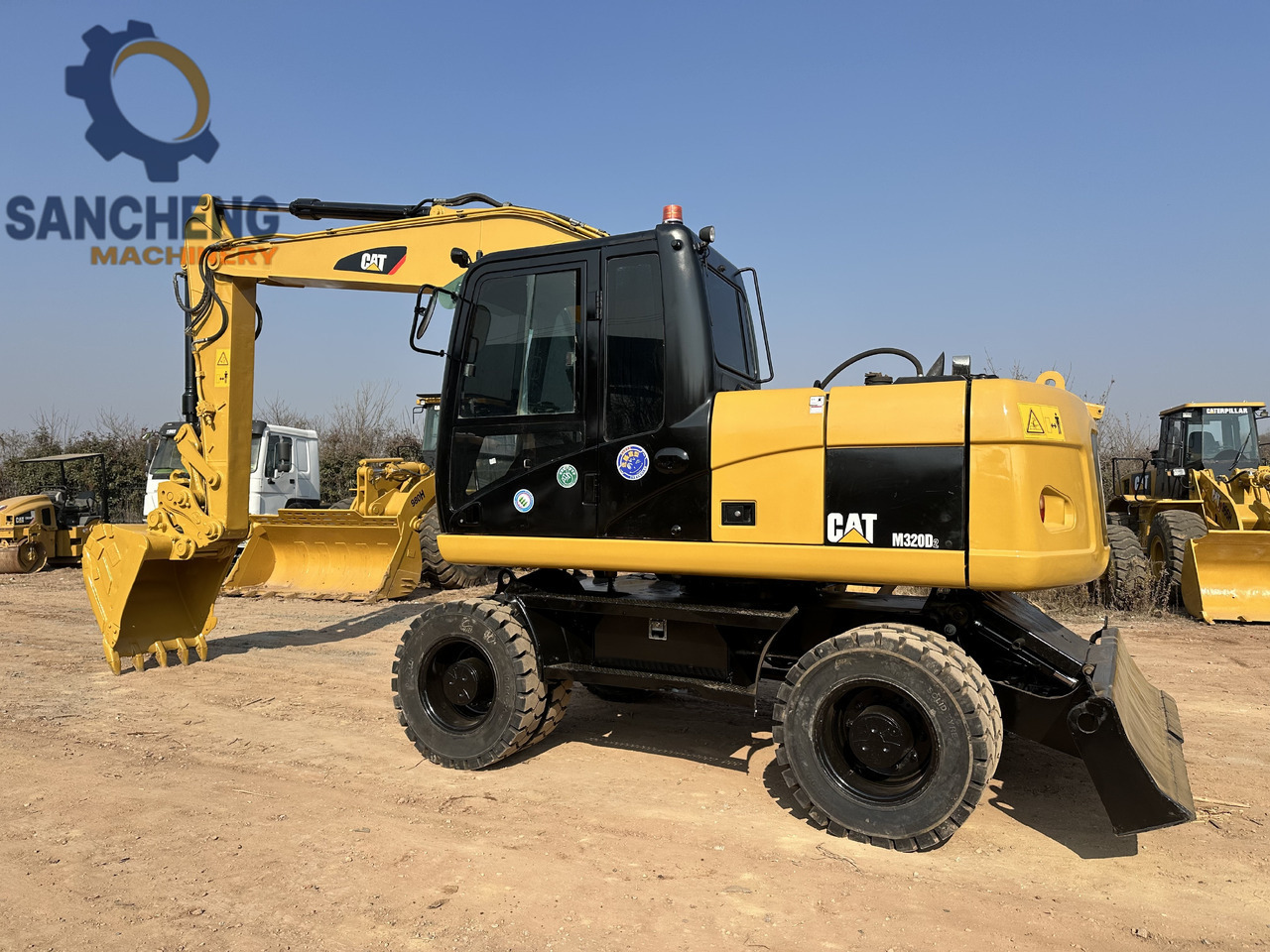 CATERPILLAR M320D2 - Escavatore gommato: foto 1 CATERPILLAR M320D2 - Escavatore gommato: foto 1
